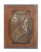 'C B' A brown patinated bronze bas relief bust plaque.
