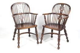 A pair of Victorian ash and elm low Windsor chairs.