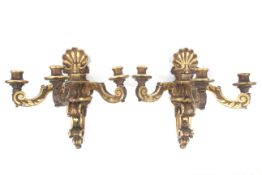 A pair of 18th century carved wooden 'Chippendale' three-branch wall brackets.