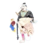 A 20th century marionette of an Asian figure.