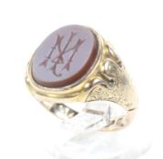A Victorian 15ct gold and sard onyx oval signet ring.
