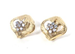 A pair of Italian '18K' and blue topaz cluster clip earrings.