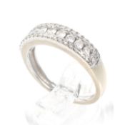 A modern 18ct white gold and diamond three row half-eternity ring.