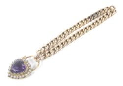 A late Victorian gold hollow-curb link bracelet on a heart-shaped padlock clasp.