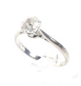 An early-mid 20th century diamond solitaire ring. The cushion-shaped old-cut stone approx. 0.