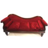A Victorian mahogany showwood chaise longue.