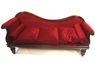 A Victorian mahogany showwood chaise longue.