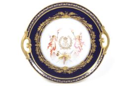 A Sevres porcelain twin handled circular tray.