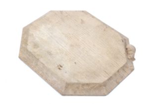 A Robert 'Mouseman' Thompson an oak carved square octagonal bread board with the eponymous mouse.