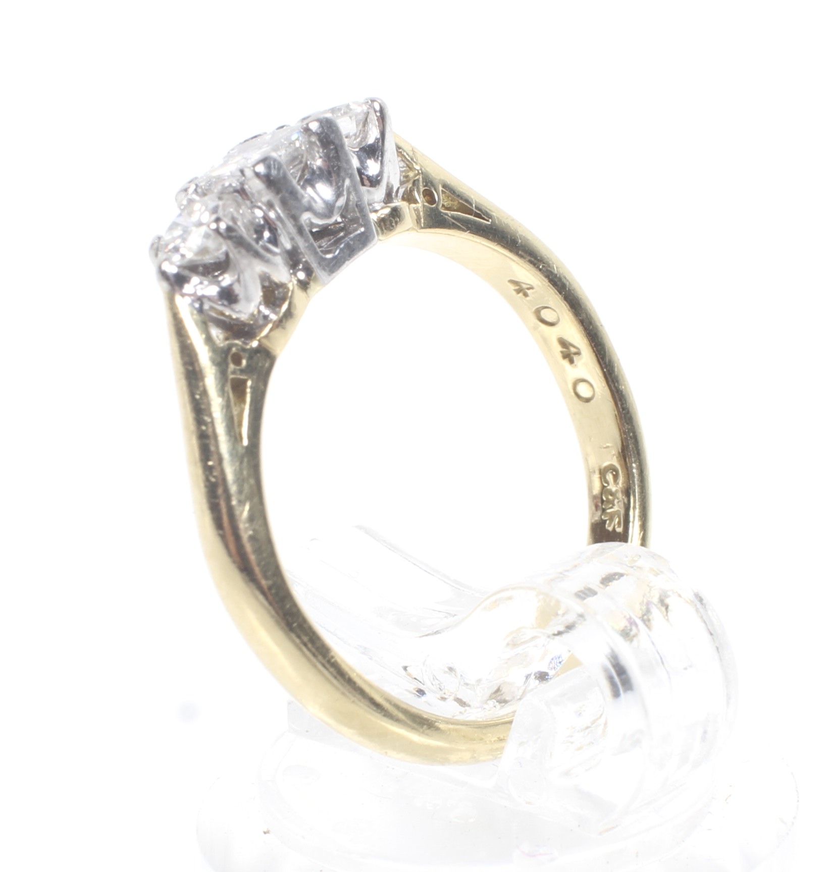 A modern 18ct gold and diamond three stone ring. - Image 4 of 4