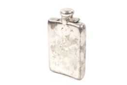 An early 20th century silver concave-oblong half-pint spirit or hip flask.