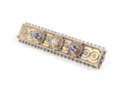 A late Victorian gold, sapphire and diamond rectangular brooch in Etruscan style.