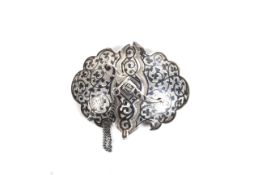 A Russian silver and niello cartouche-shaped two-piece belt buckle with a dagger clasp.