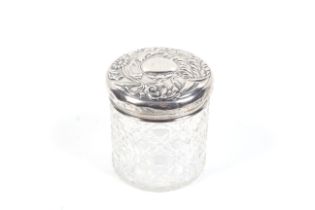 A silver mounted hobnail-cut clear glass cylindrical dressing table jar.