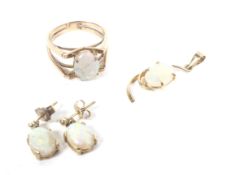 A small collection of gold and white opal jewellery to include a single stone ring.
