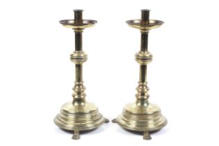 A pair of 19th century brass Gothic candlesticks.