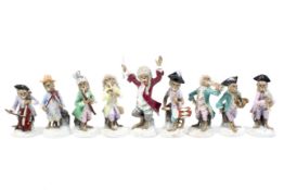 An early 20th century German porcelain Meissen style monkey band group of nine figures.