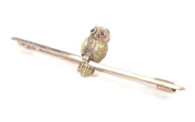An early 20th century bloomed gold 'Owl' bar brooch.