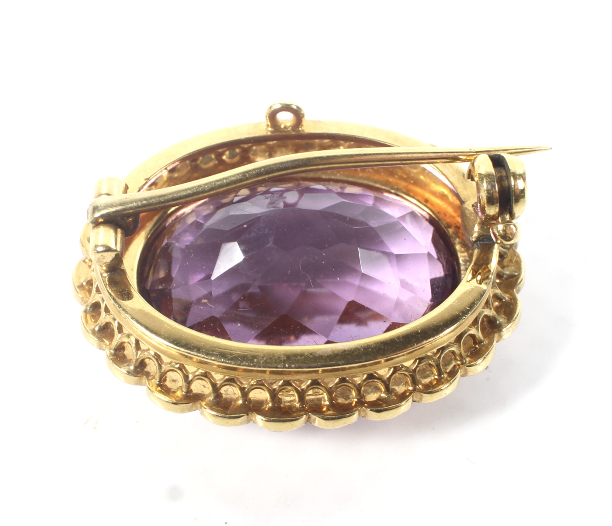 A late Victorian gold, amethyst and half-pearl oval brooch. - Image 2 of 2