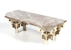 A late 19th century Neo-Gothic carved oak and rouge marble topped table.