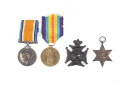 Four British WWI and WWII war medals and badges. Comprising: The WWI Victory medal (202141 PTE. A.