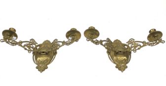 A pair of Art Noveau style brass adjustable wall brackets.