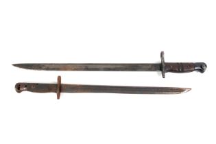 A Remington model 1913 bayonet and a similar example.