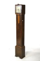 An Art Deco oak cased grandmother clock.