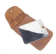 A WWI officers signal/shaving mirror, in a brown leather pouch.