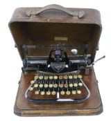 A Victorian Blickensderfer no. 7 portable manual typewriter. In its original wooden travelling case.