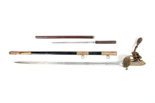 A Royal Navy officer's dress sword and a swagger stick.