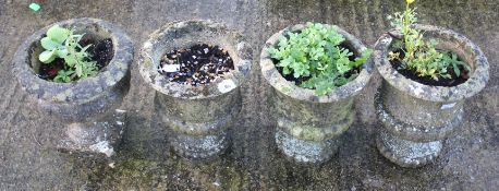 A set of three composite stone garden urns and one other. With circular and square bases, Max.