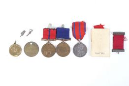 Three Metropolitan Police medals and one other.