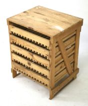 A pine storage cabinet designed for apples.