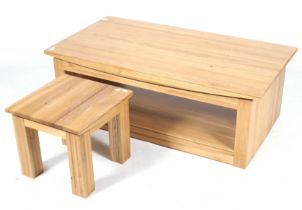 A contemporary oak coffee table and a similar smaller table.