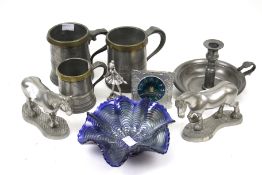 A collection of pewter and a glass bowl. Including tankards, a candlestick, clock, etc. Max.