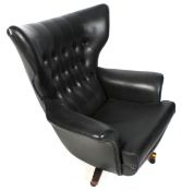 A mid-century G Plan 'Blofeld' model 62 swivel armchair.