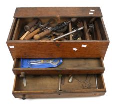 An vintage wooden tool box and contents.