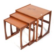 A mid-century G-Plan (red label) nest of three tables.