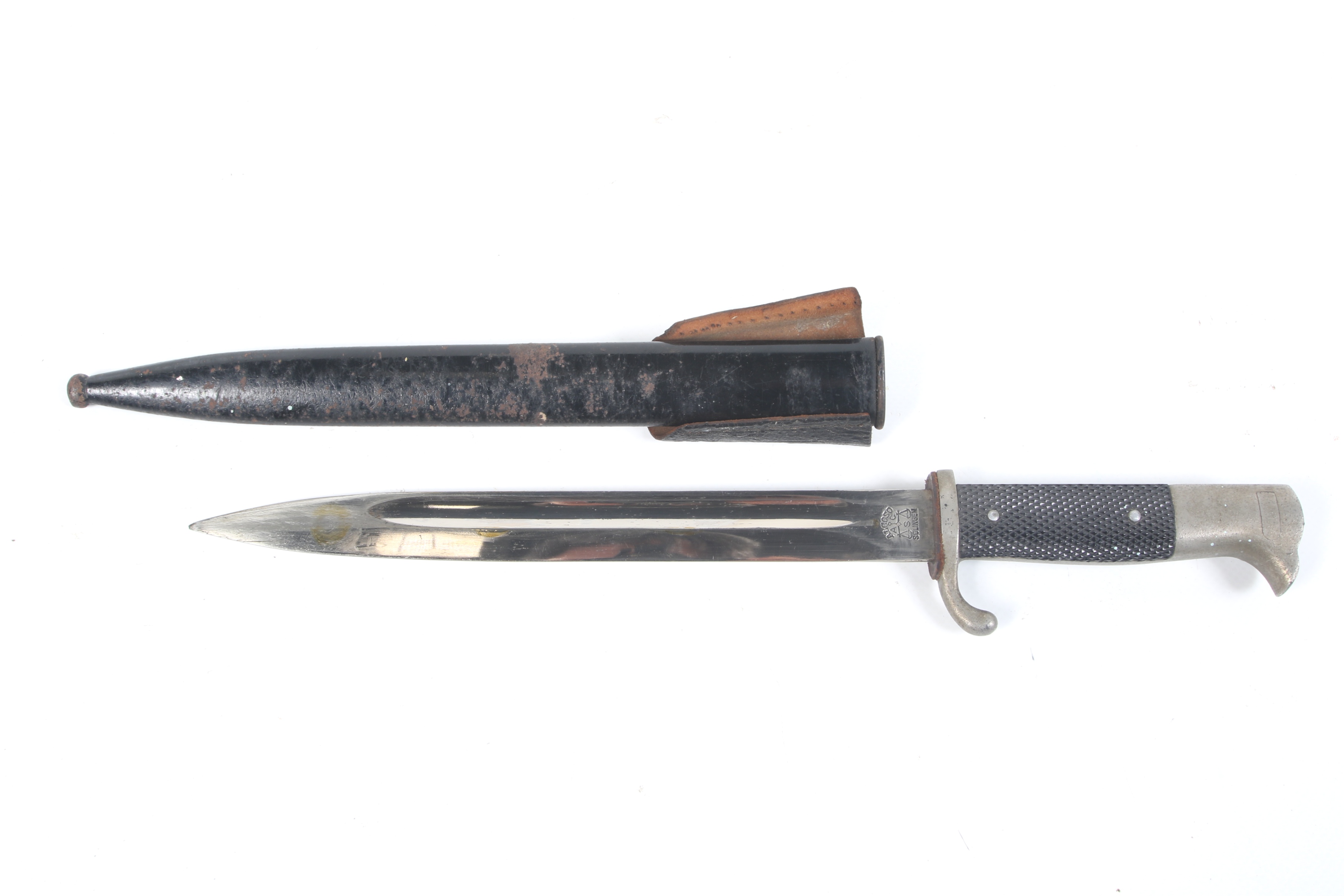 A German WWII bayonet. Marked Alcoso Solingen to blade, in a metal scabbard. L40.