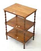 A vintage oak three tier table.