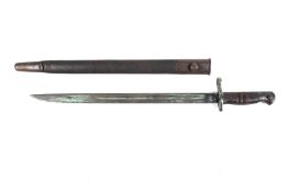 A WWI Remington model 1913 bayonet. In leather and metal scabbard.