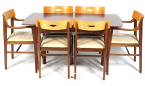 A mid century Ian Henderson Design Heals dining table and six chairs.
