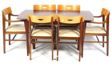 A mid century Ian Henderson Design Heals dining table and six chairs.