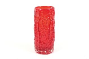 A mid-century Geoffrey Baxter Whitefriars red glass 'bark' vase. H23.