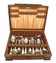 A vintage oak canteen of flatware. Consisting of forks and spoons only.