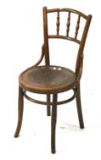 A vintage bent wood dining chair.