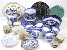 An assortment of blue and white china. Including Mason's jug and willow pattern tea set, etc.