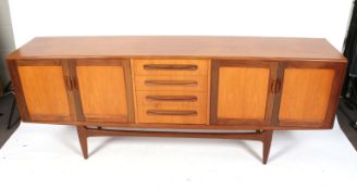 A G Plan mid-century two tone wood sideboard. Four central drawers flanked by cupboards.