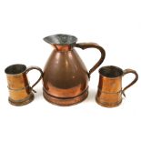 A copper jug and two tankards.